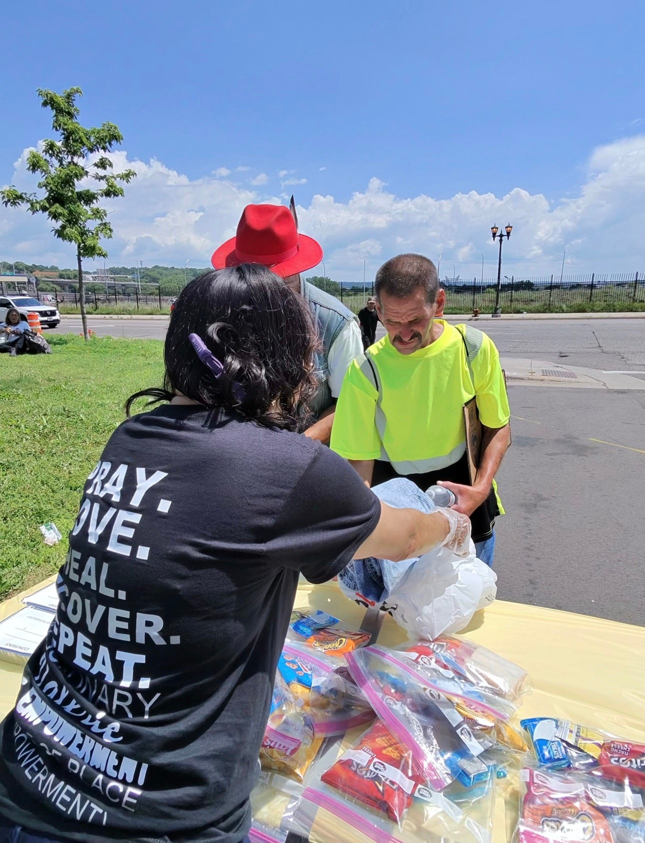 Threshold to Thrive volunteers handing out food bags
